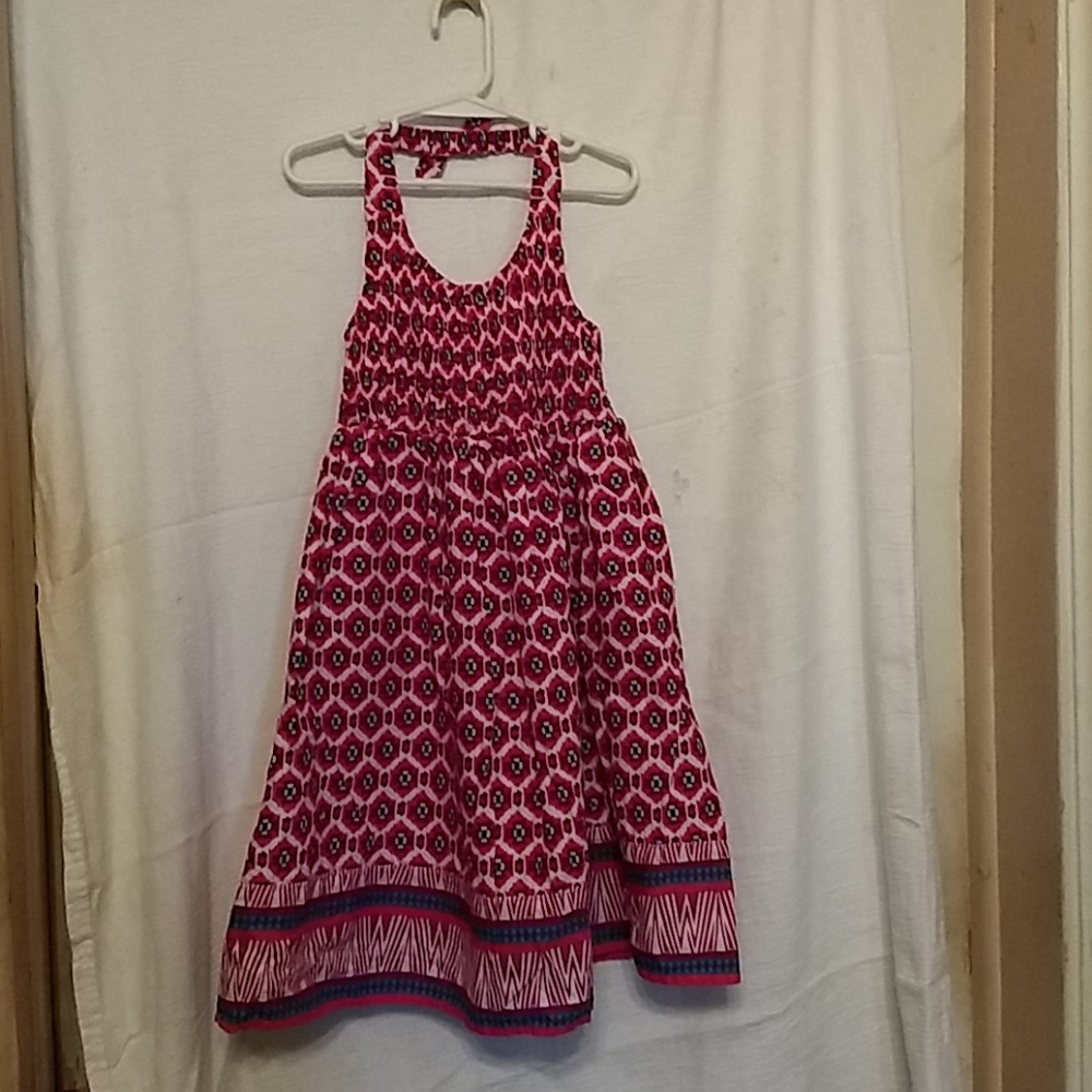 A bright and colorful halter style summer dress